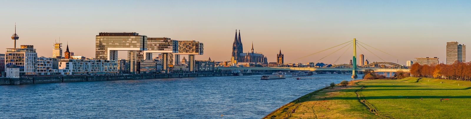 Cologne skyline at golden hour with the cathedral and the Rhine